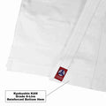 Close-up of a white martial arts uniform showing a reinforced bottom hem with a small red Kyokushin KAN, plus a text callout explaining the reinforced hem.