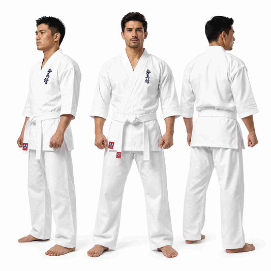 Three views of a man modeling a white martial arts uniform with a white belt, shown against a plain white studio background. The front, back, and side views display the uniform's fit and details, including a small red and white logo patch on the left hip and a blue graphic on the chest.