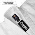 Close-up of a white martial arts gi lapel showing two Kyokushin brand labels, including a text callout that reads 'Kyokushin Grade Thick Eva Lapel.'.