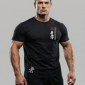 Man wearing a black Kyokushin t-shirt with a logo and text on a gray background