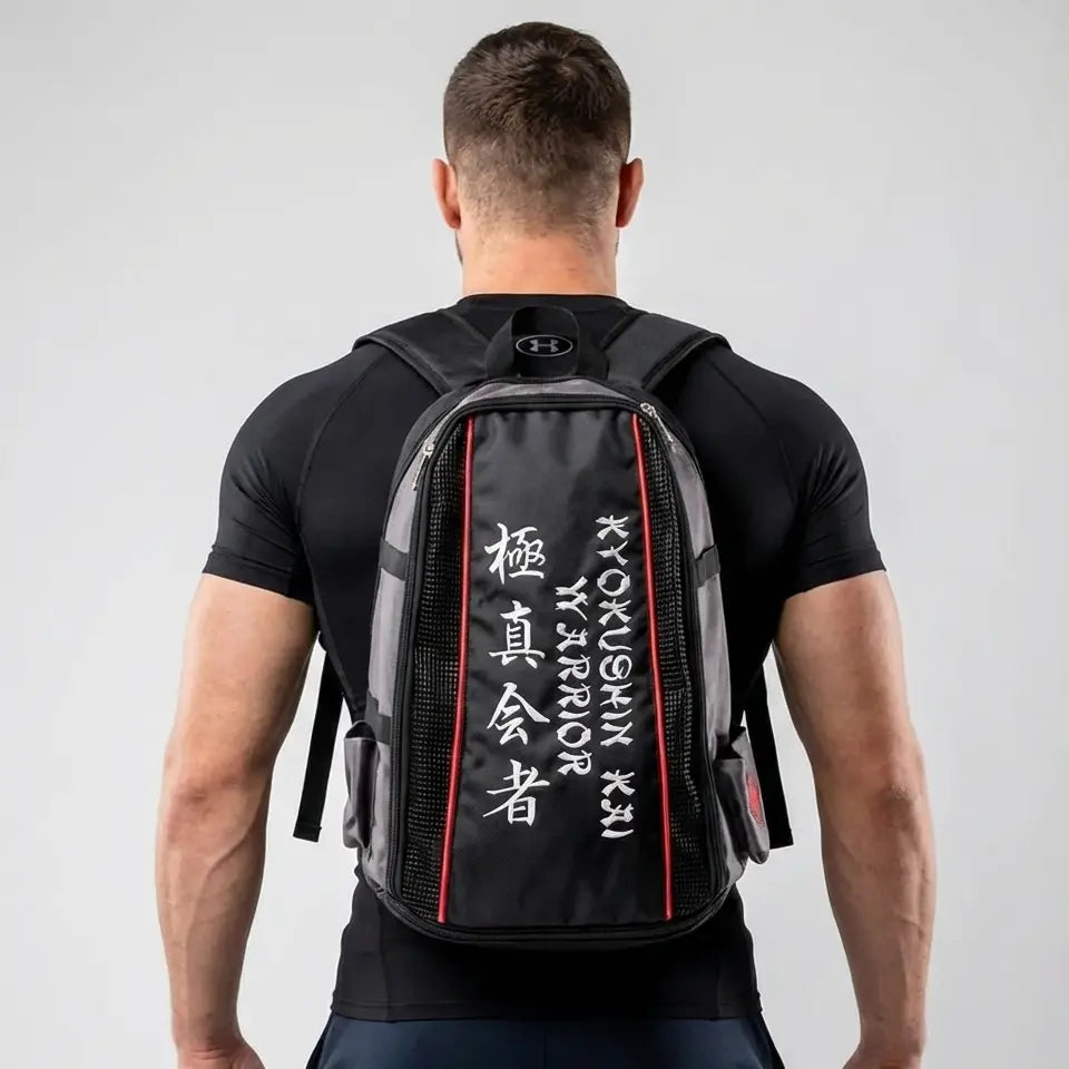 Person wearing a black Kyokushin Kai backpack with white text on a gray background
