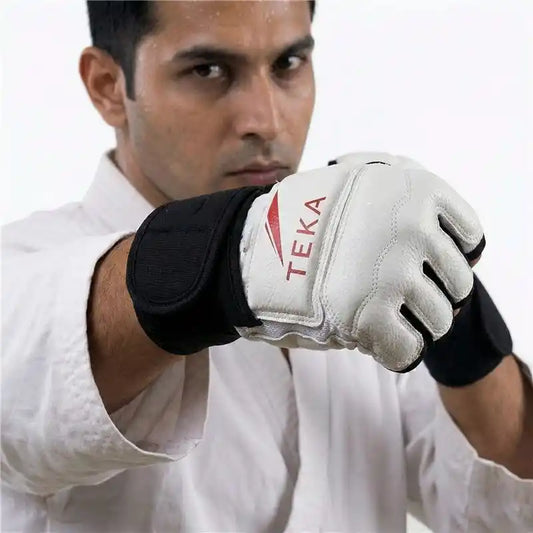 Person wearing a white Taekwondo glove with Teka branding on a white background